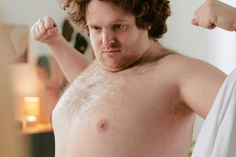 young overweight male flexing